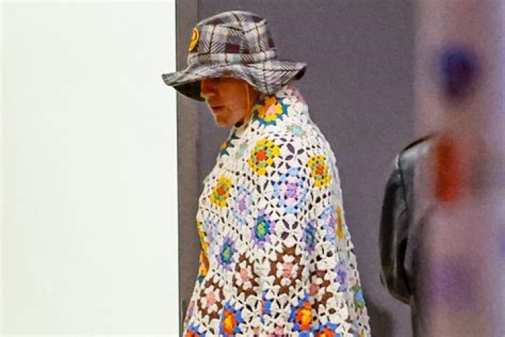 
Justin Bieber Cozies Up in a Crochet Blanket for L.A. Dinner Date Night with Wife Hailey Bieber 